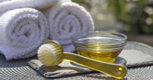 Spa towels with scrub brush and massage oil | Gunther Kia