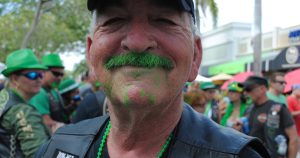 Man with a green mustache at a Fort Lauderdale, FL St. Patrick's Day Parade | Gunther Kia