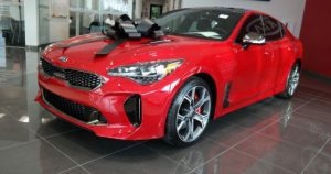 Red 2018 Kia Stinger with a big black bow on top |  Gunther Kia